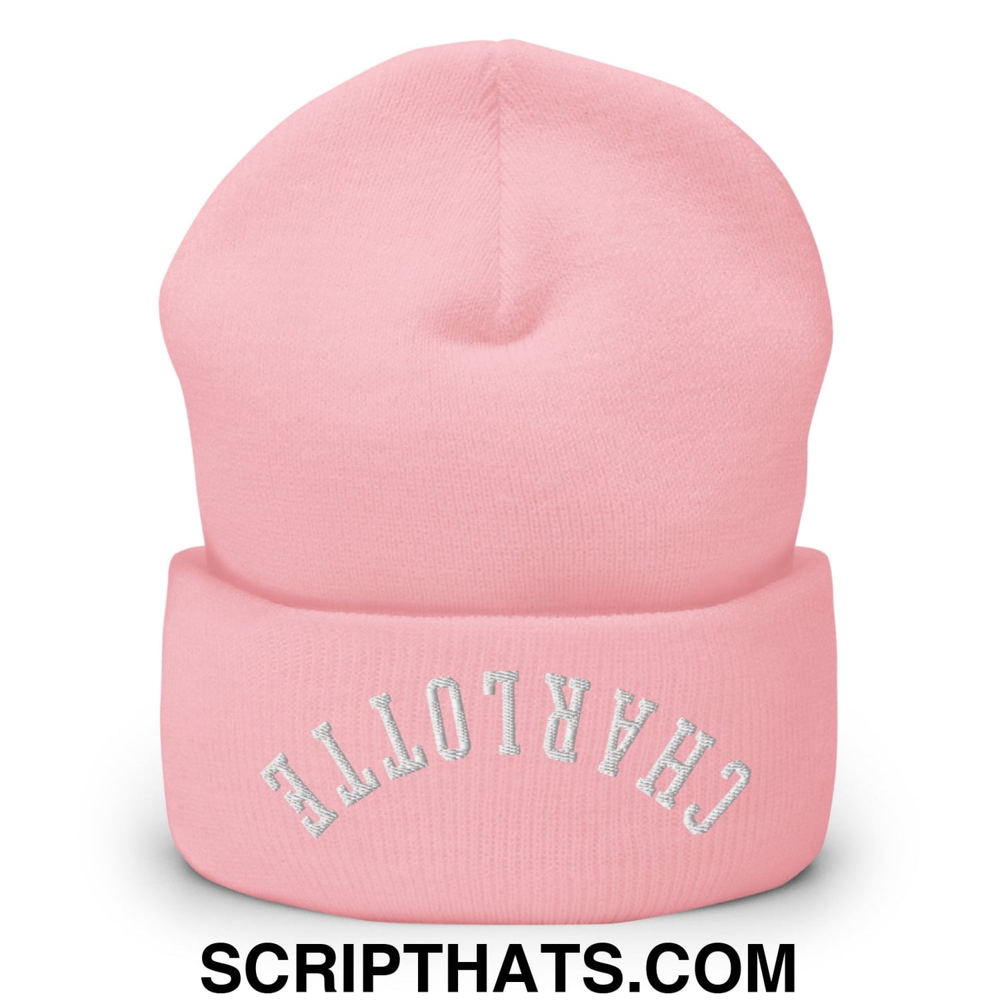 A soft pink knit cuffed beanie with upside down charlotte embroidered in silver thread on the brim