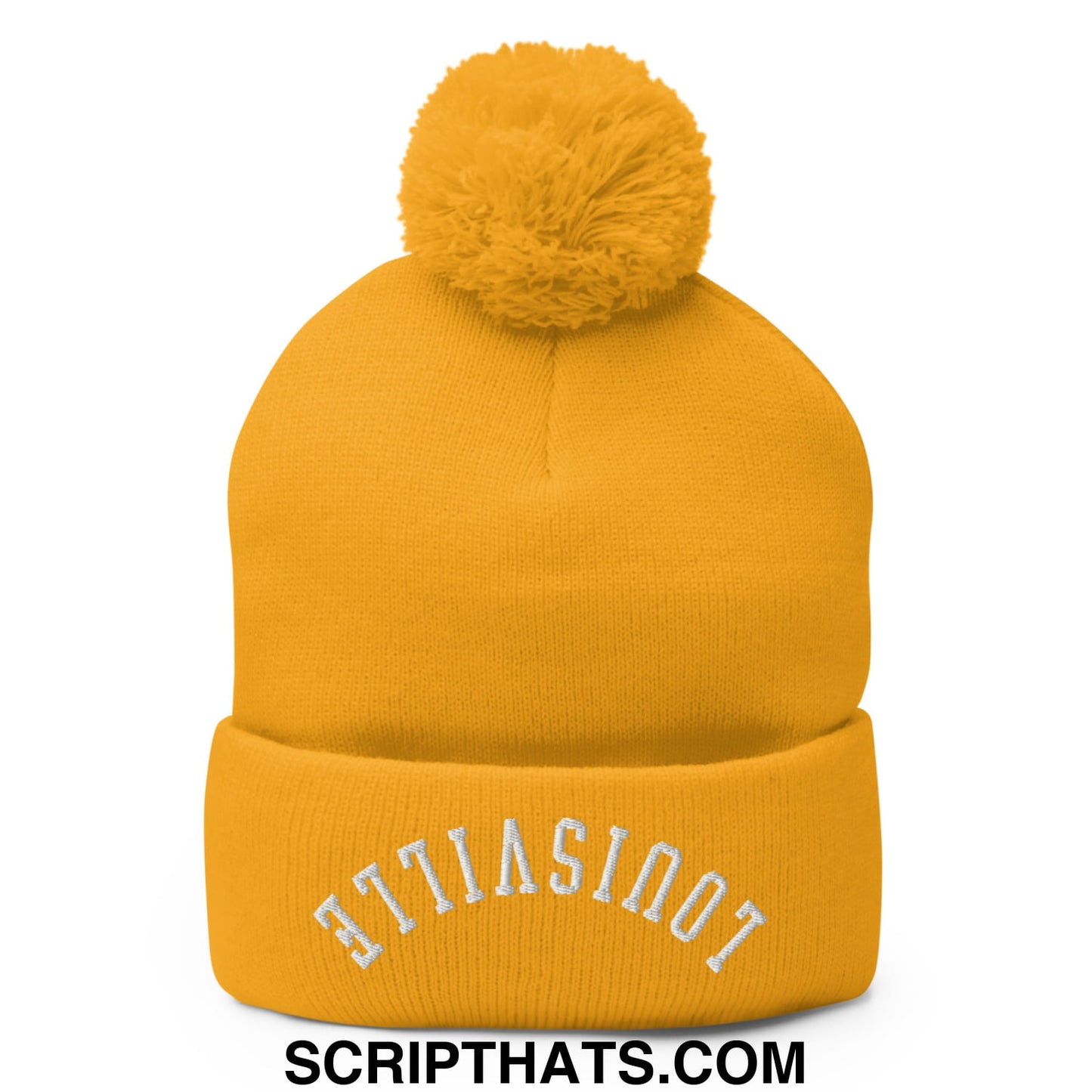 A mustard-yellow knit beanie with a matching pom pom and upside down louisville embroidery on the cuff