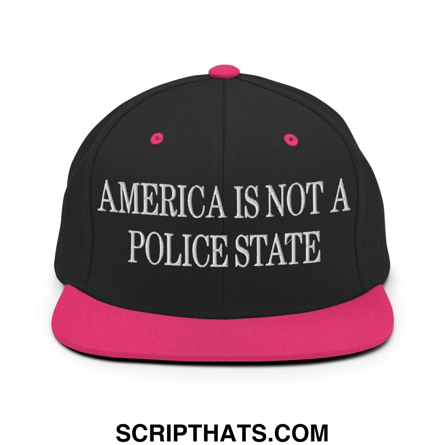 Black snapback hat with vibrant pink brim and button featuring white embroidered america is not a police state text