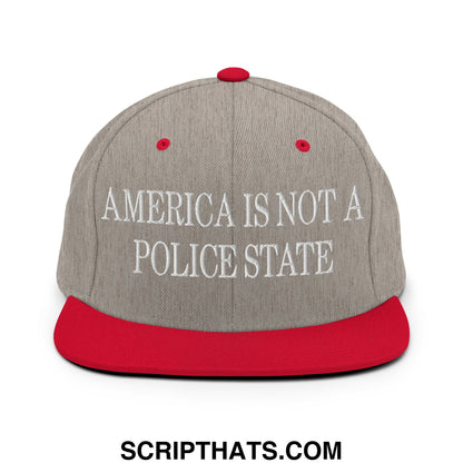 Gray and red snapback hat with white embroidered america is not a police state text and flat bill brim design