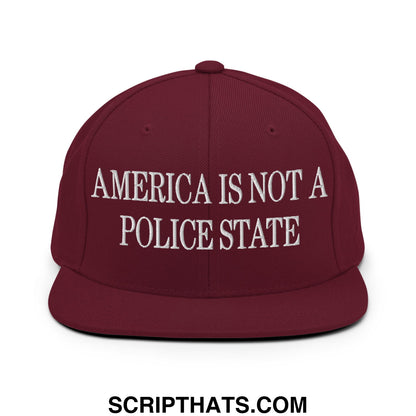 Maroon flat bill brim snapback hat with white embroidered text america is not a police state