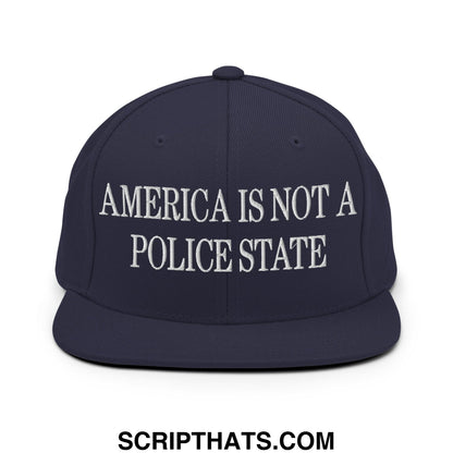 Navy blue snapback hat with white embroidered text america is not a police state flat bill brim design