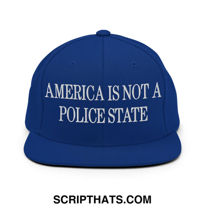 Royal blue snapback hat with white embroidered america is not a police state text and flat bill brim design