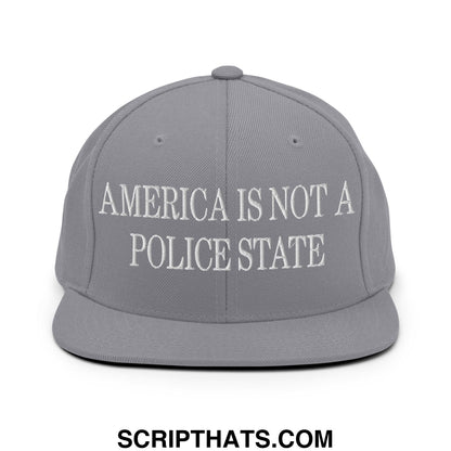 Gray snapback hat with white embroidered america is not a police state text and flat bill brim design