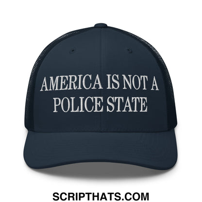 Dark navy mesh trucker hat with white embroidered america is not a police state text on the front panel