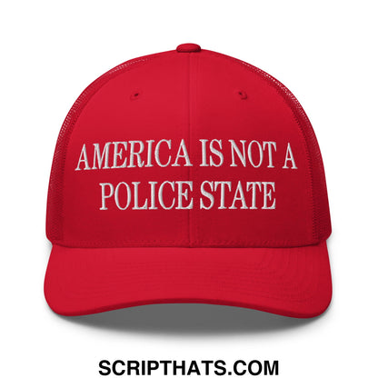 Red embroidered mesh trucker hat with white text america is not a police state across the front