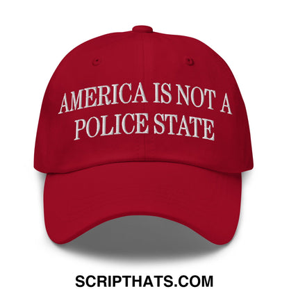 Red embroidered cotton dad hat with white text reading america is not a police state for casual wear