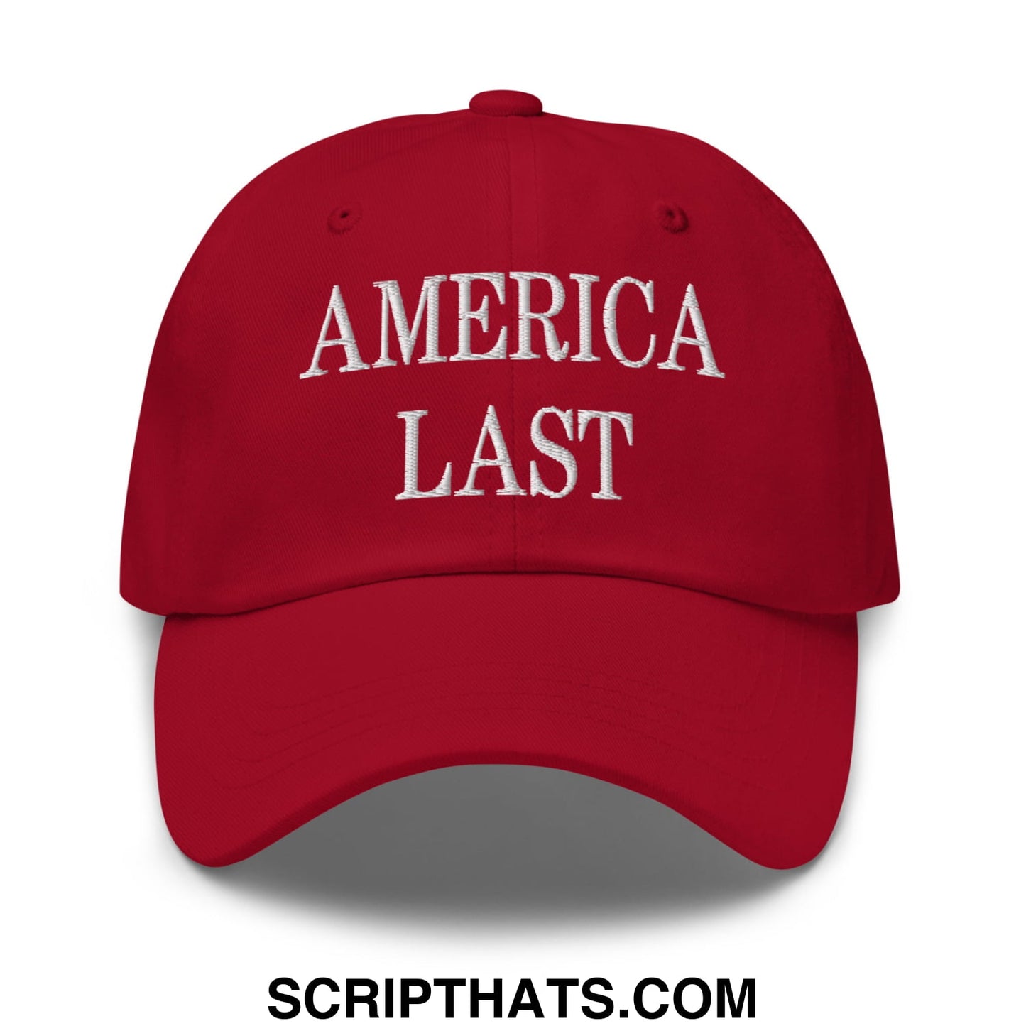 Red unstructured dad hat with america last embroidered in white thread across the front for casual wear