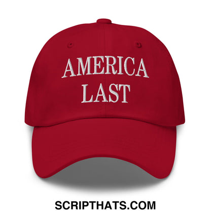 Red unstructured dad hat with america last embroidered in white thread across the front for casual wear
