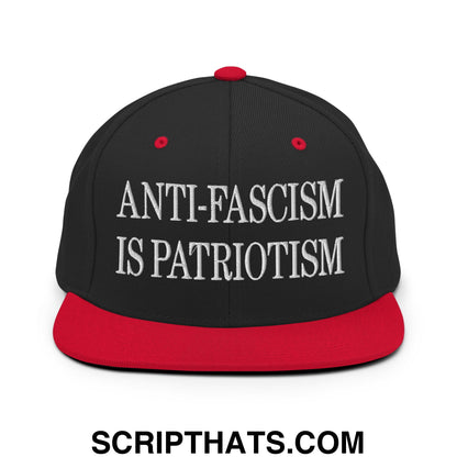 Black and red snapback hat with white embroidered text reading anti-fascism is patriotism flat bill brim