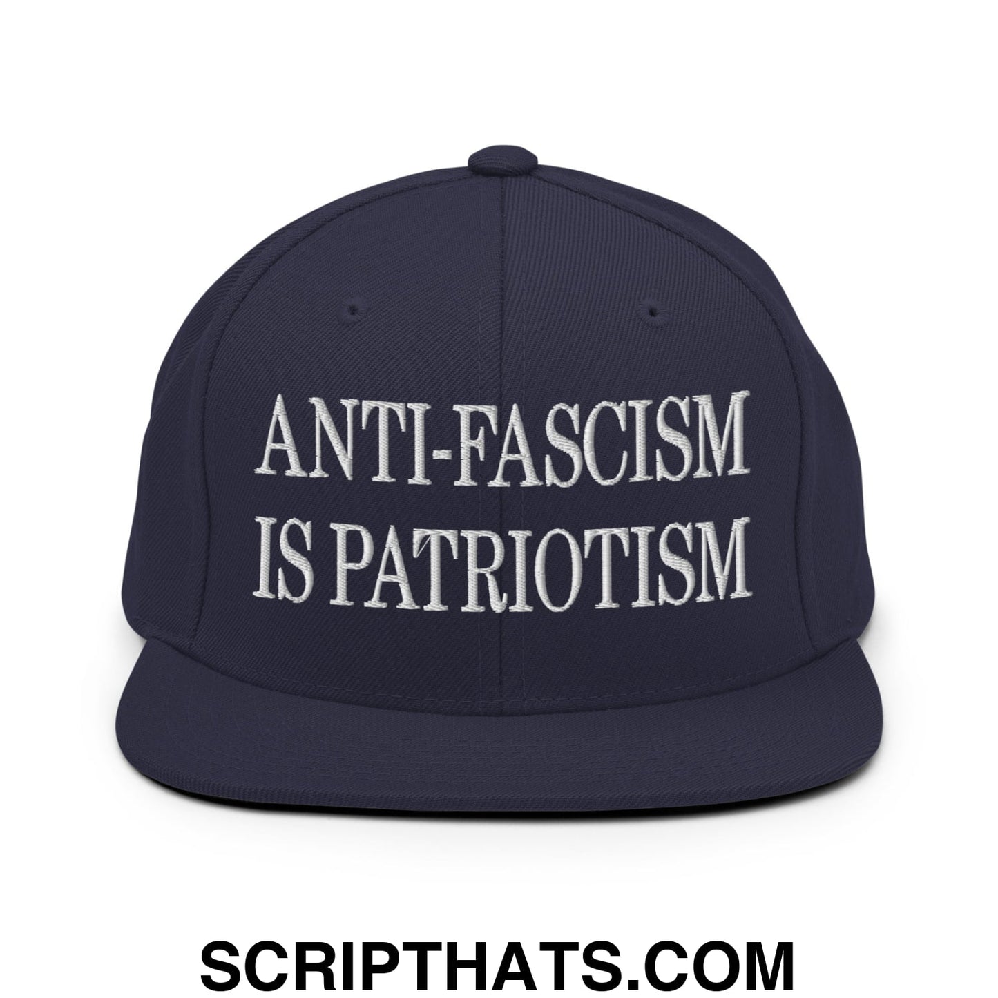 Navy blue snapback cap with white embroidered anti-fascism is patriotism text and flat bill brim design