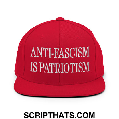 Red snapback cap with white embroidered text reading anti-fascism is patriotism flat bill brim snapback hat