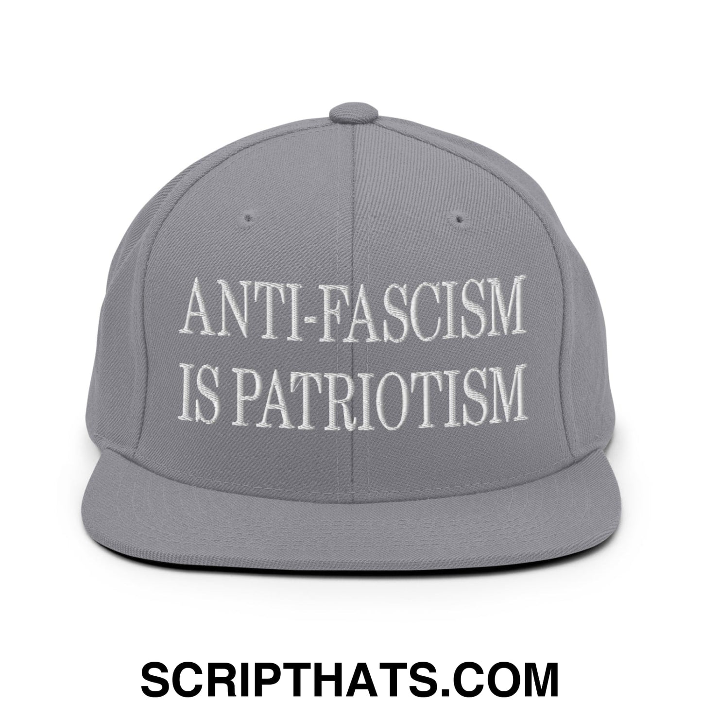 Gray snapback hat with white embroidered anti-fascism is patriotism text and flat bill brim design