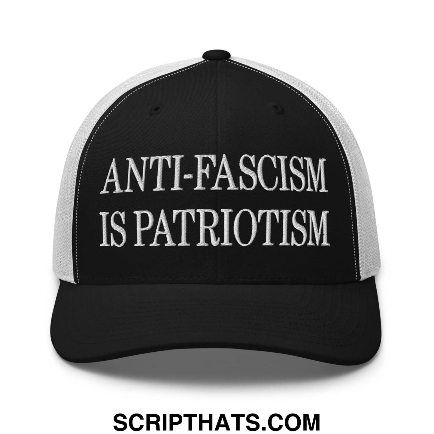 Black and white mesh trucker hat with embroidered anti-fascism is patriotism text in bold uppercase letters