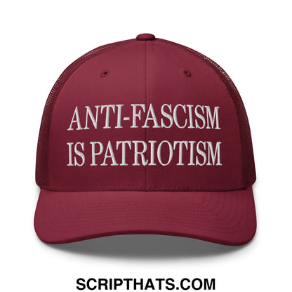 Maroon mesh trucker hat with white embroidered anti-fascism is patriotism text for casual wear
