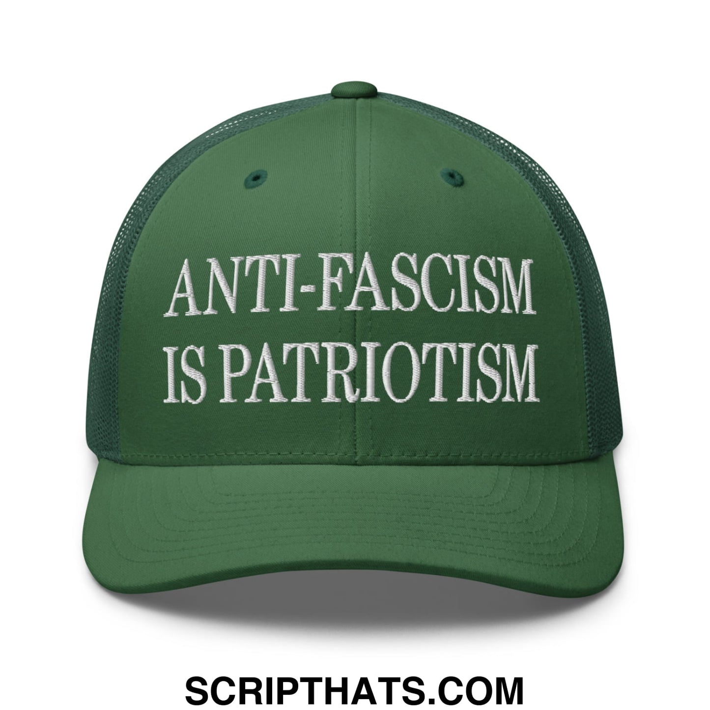 Dark green mesh trucker hat with white embroidered anti-fascism is patriotism text on the front panel