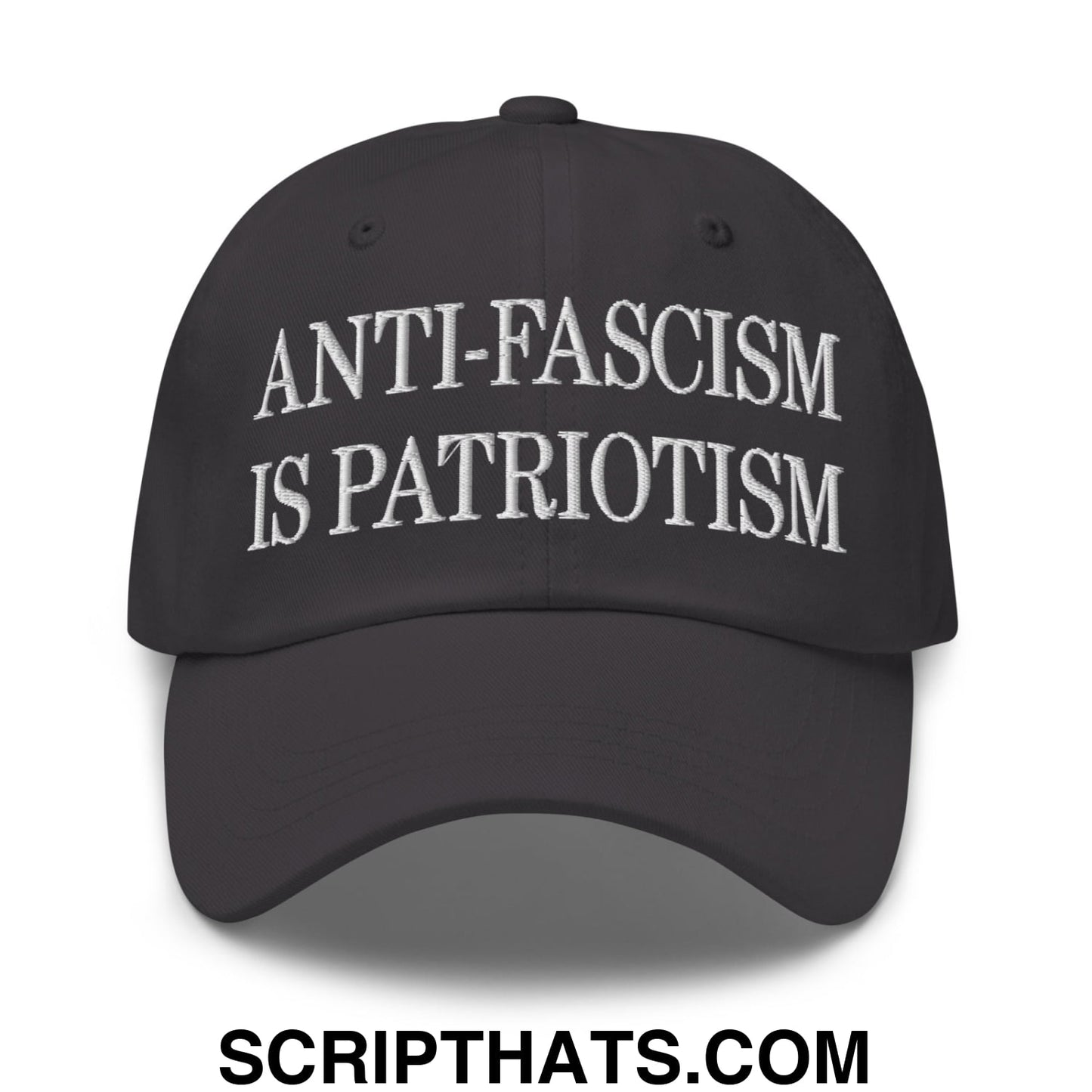 Black unstructured dad hat with white embroidered anti-fascism is patriotism text in a casual style