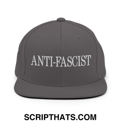 Dark gray snapback hat with white embroidered anti-fascist text and flat bill brim for casual wear