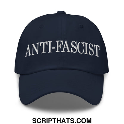 Navy blue unstructured dad hat with white embroidered anti-fascist text across the front panel