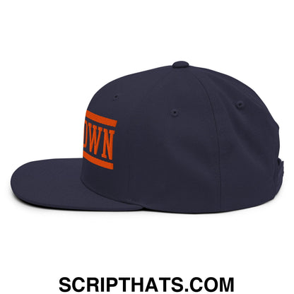 Navy blue flat bill snapback hat with bold orange bear down embroidered lettering and rectangular bars