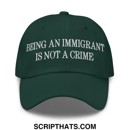 Dark green unstructured dad hat with white embroidered text being an immigrant is not a crime for casual wear