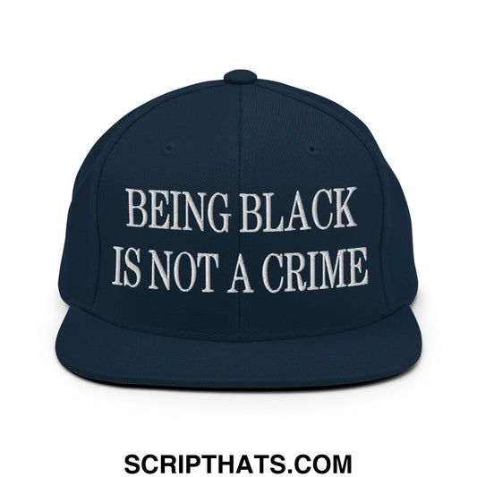 Navy blue flat bill brim snapback hat with white embroidered text being black is not a crime