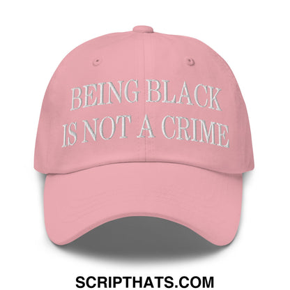 A soft pink unstructured dad hat embroidered with being black is not a crime in white thread on the front