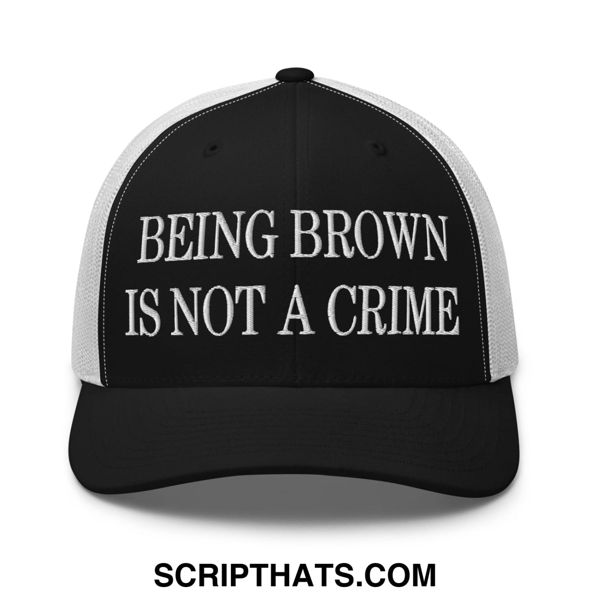 Black and white mesh trucker hat with embroidered being brown is not a crime text in bold capital letters