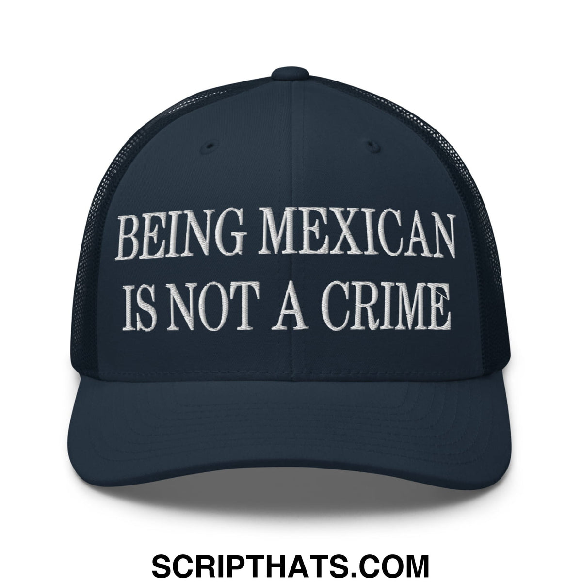 Dark navy embroidered mesh trucker hat with white text being mexican is not a crime across the front
