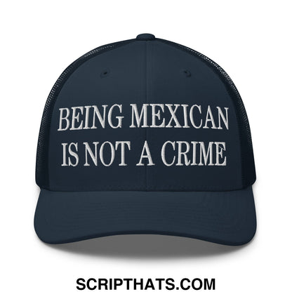Dark navy embroidered mesh trucker hat with white text being mexican is not a crime across the front