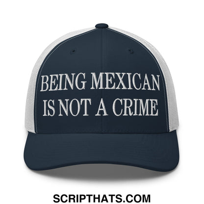 Navy blue and white mesh trucker hat with embroidered text being Mexican is not a crime