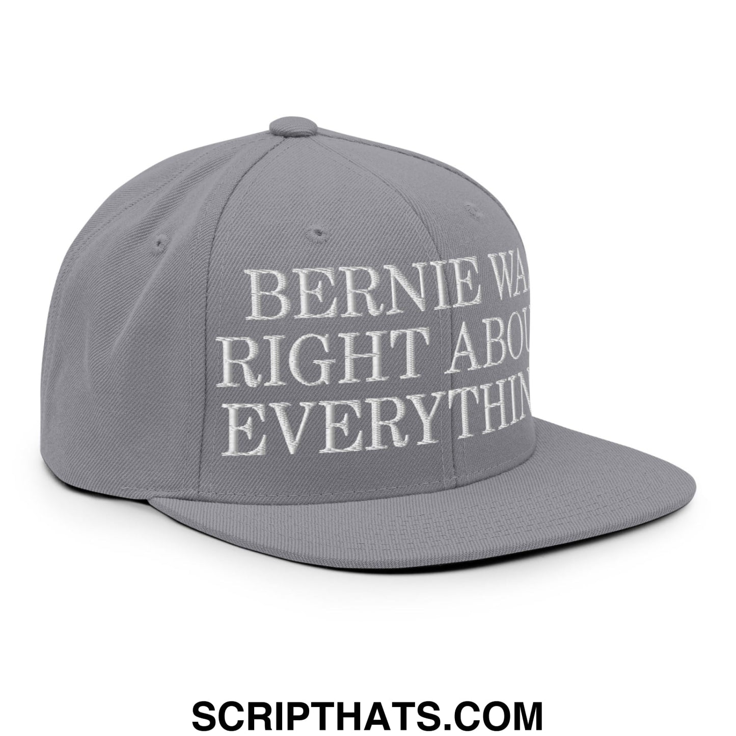 Gray snapback hat with white embroidered flat bill brim text reading bernie was right about everything