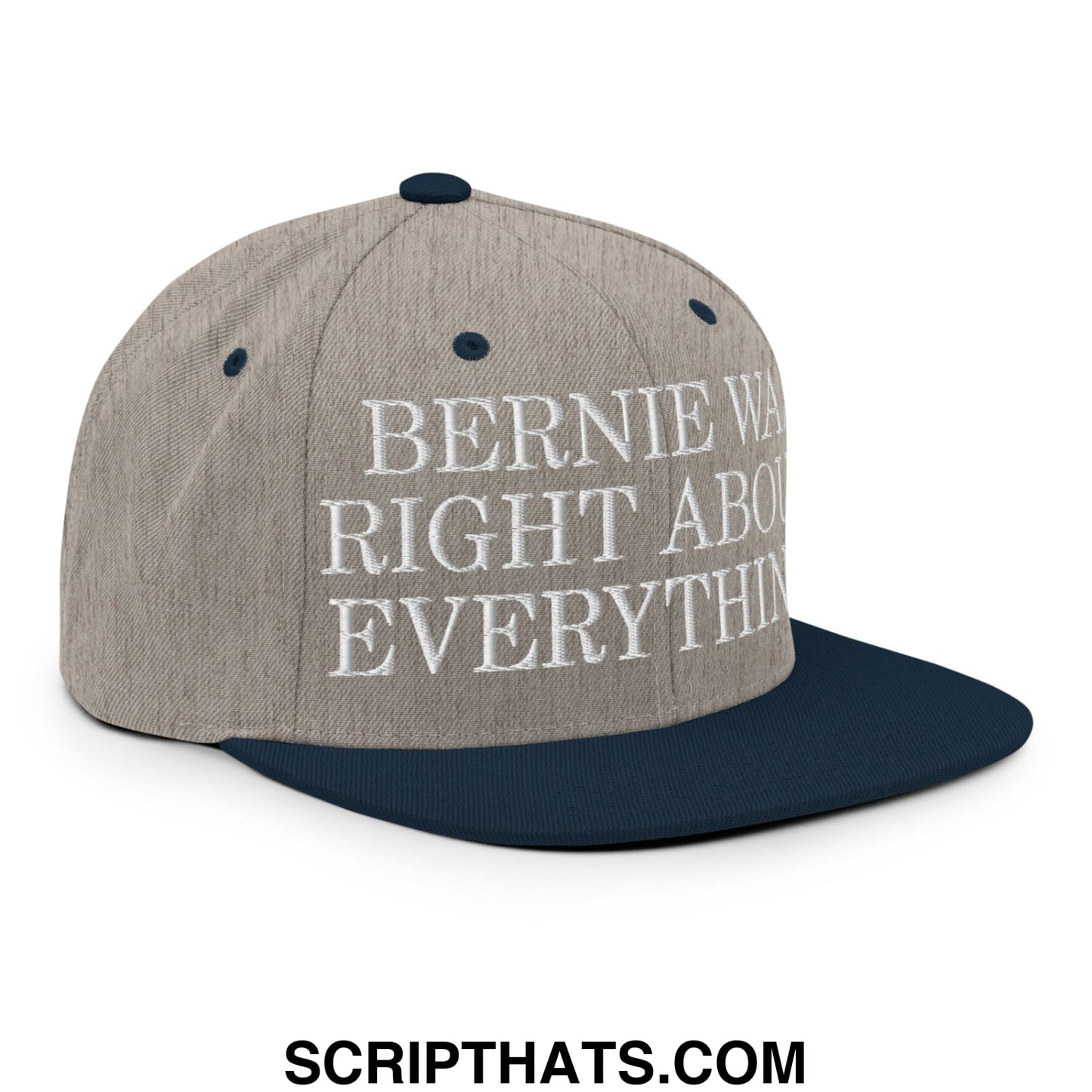 A gray and navy blue snapback hat with white embroidered text bernie was right about everything on a flat bill brim