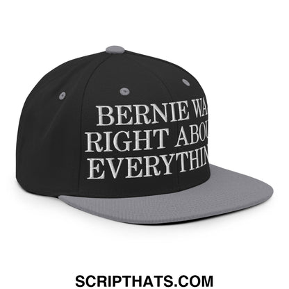 Black and gray snapback hat with white embroidered text saying bernie was right about everything flat bill brim