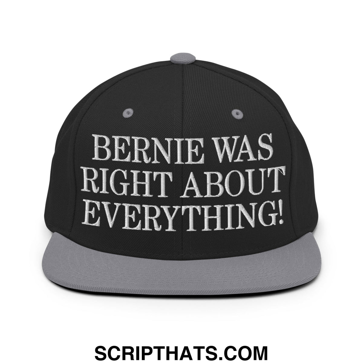 Black snapback cap with gray brim embroidered with white text saying bernie was right about everything flat bill design