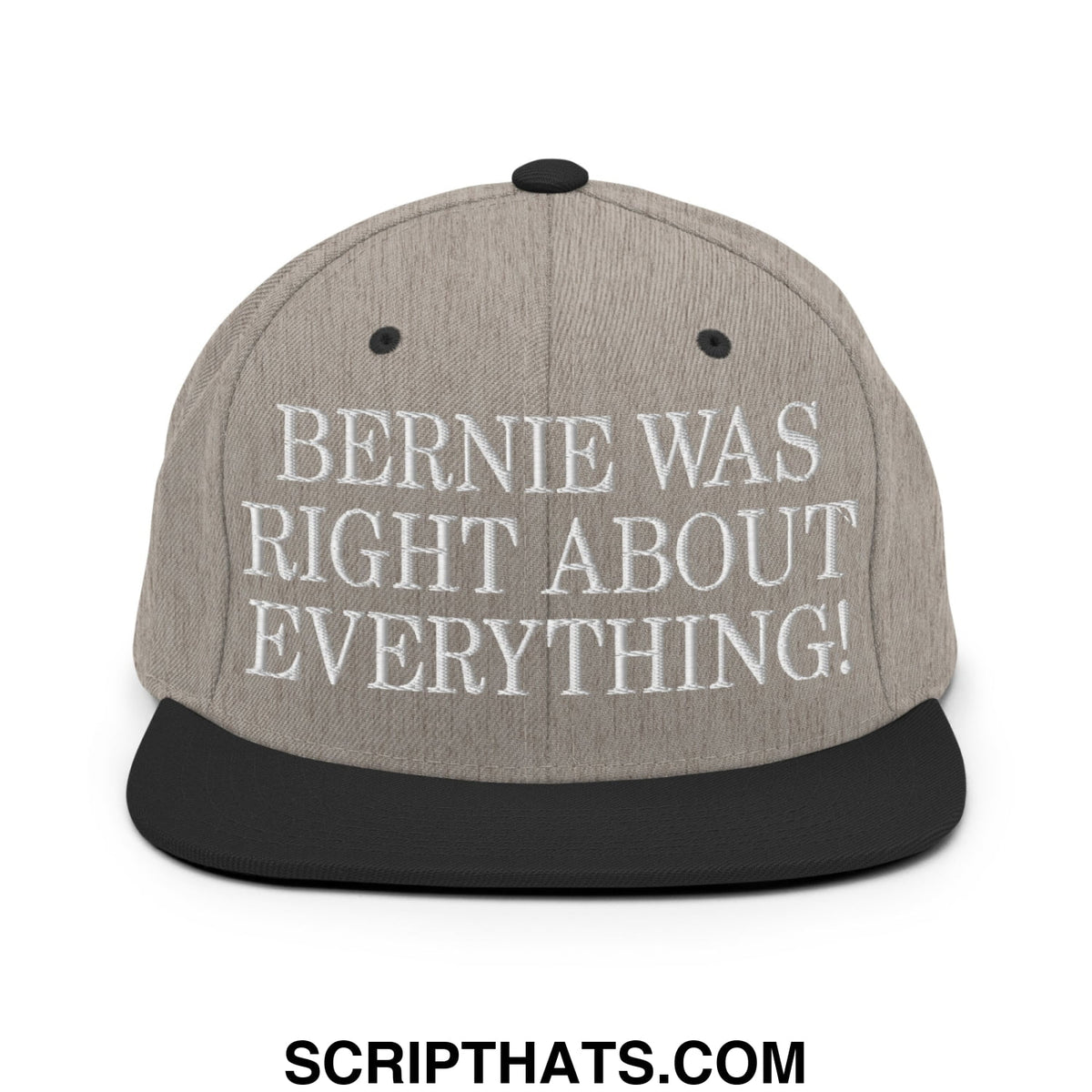 Gray snapback hat with black brim and embroidered white text saying bernie was right about everything on front