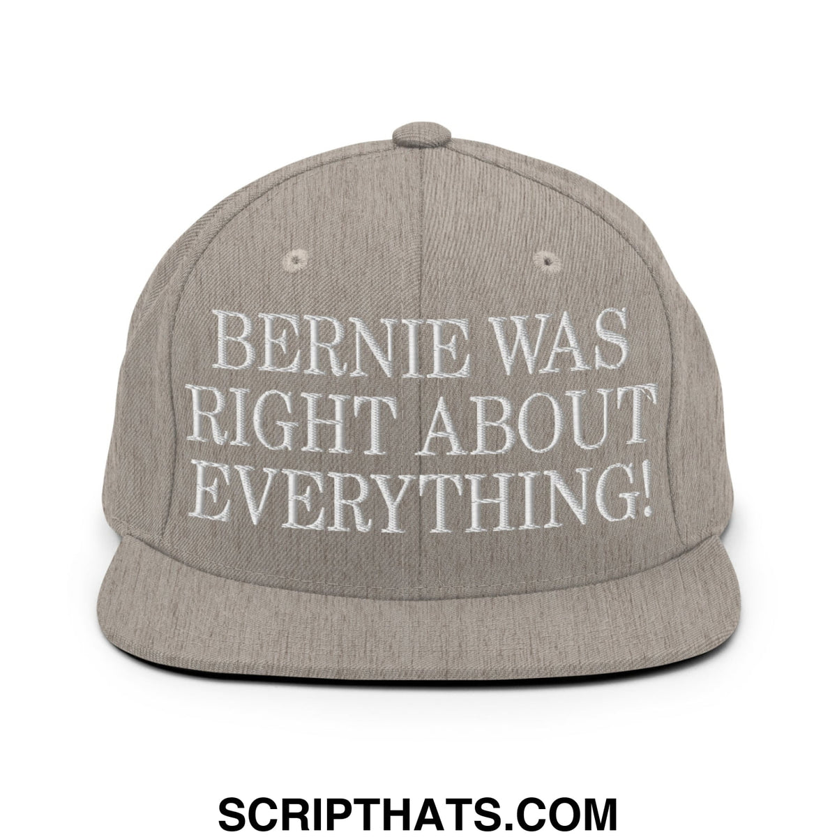 A gray snapback hat with white embroidered text bernie was right about everything featuring a flat bill brim