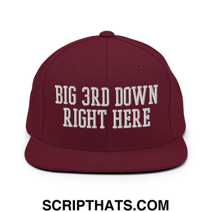 Maroon snapback hat with white embroidered big 3rd down right here text and flat bill brim design