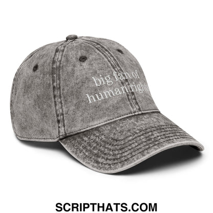 A faded gray denim unstructured dad hat with white embroidered text big fan of human rights