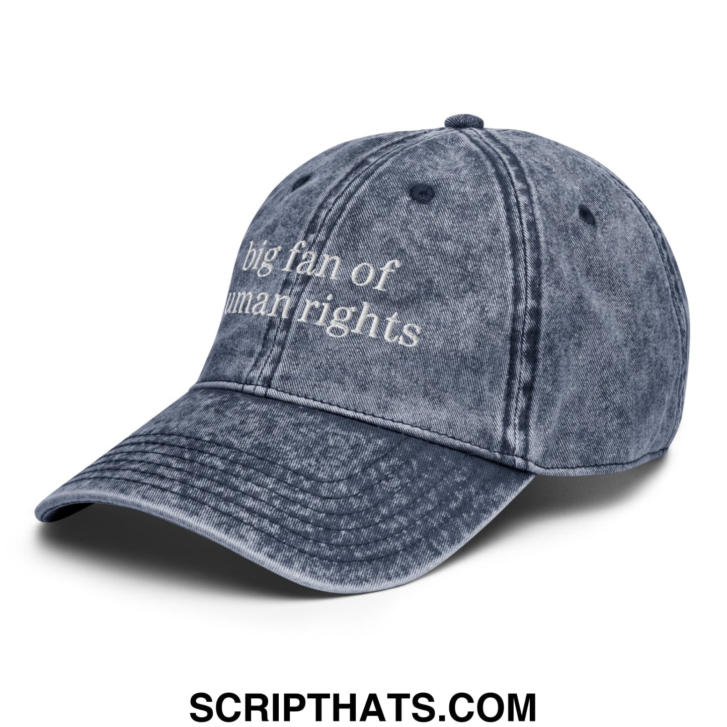 A faded blue denim dad hat with white embroidered text big fan of human rights in an unstructured design