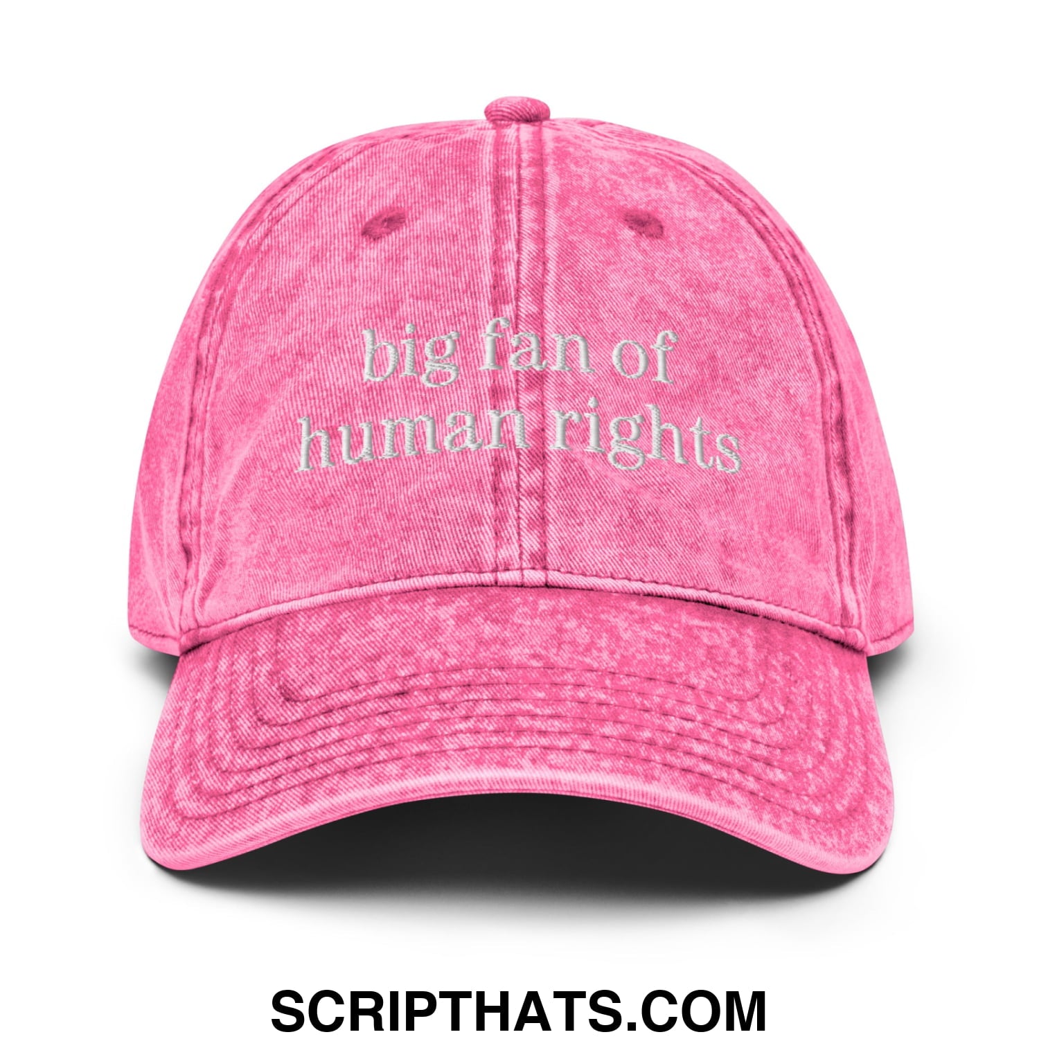 A faded pink denim dad hat embroidered with big fan of human rights text in white on the front