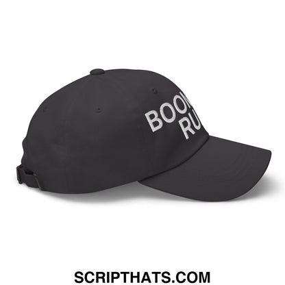 Black unstructured dad hat with white embroidered boom run text from boomers rule collection