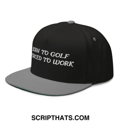 Black snapback cap with gray brim and white embroidered text born to golf forced to work for golf enthusiasts