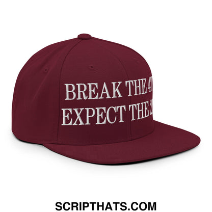 Maroon snapback hat with white embroidered break the 4 expect the 2 text and flat bill brim design