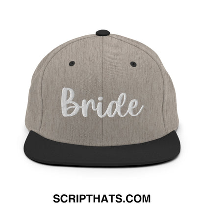 Gray and black snapback hat with bride embroidered in white script on a flat bill brim for wedding wear