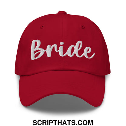 Red unstructured dad hat with white bride embroidered script on front perfect for wedding celebrations