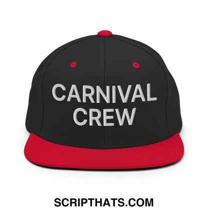 Black snapback cap with red brim and button featuring carnival crew embroidered in white thread