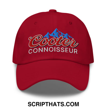 Red unstructured dad hat with embroidered cooter connoisseur logo featuring blue mountain design and red script lettering