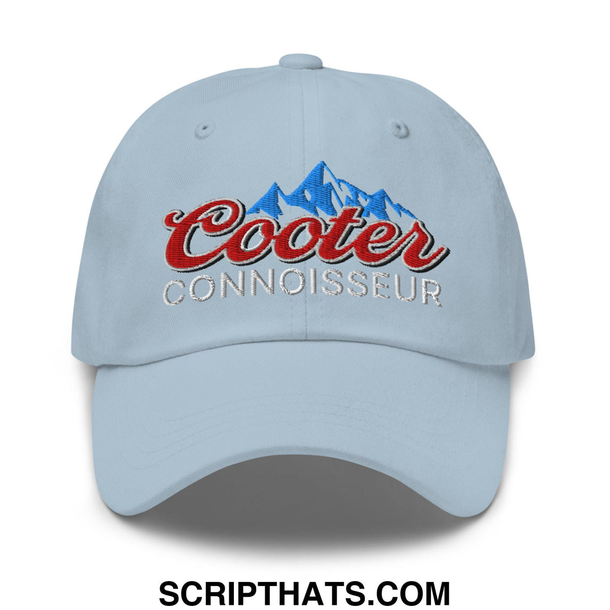 Light blue unstructured dad hat with embroidered cooter connoisseur logo in red and silver above a blue mountain design