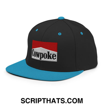 Black snapback cap with teal brim and button featuring an embroidered cowpoke logo on a red and white patch